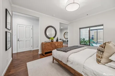 a bedroom with bed and a window