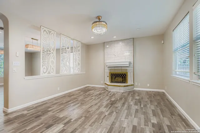 a view of a kitchen with microwave and windows