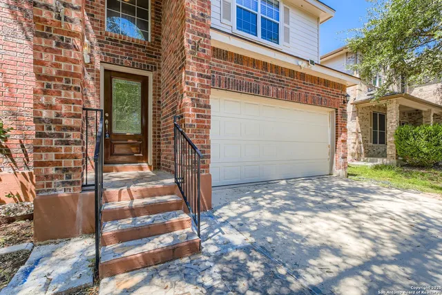 a view of a house with a door and wooden walls