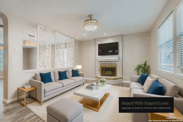 a living room with furniture and kitchen view