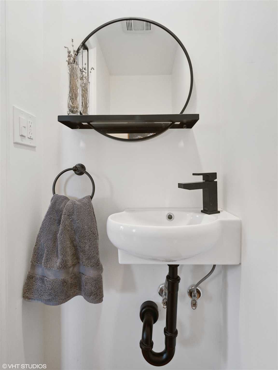 20 John Street Beacon, NY 12508 - Photo 11 of 36 a bathroom with a sink and mirror