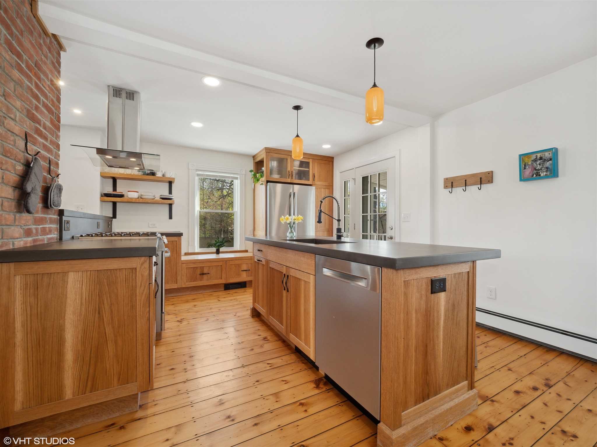 20 John Street Beacon, NY 12508 - Photo 14 of 36 a kitchen with stainless steel appliances granite countertop wooden floors and sink