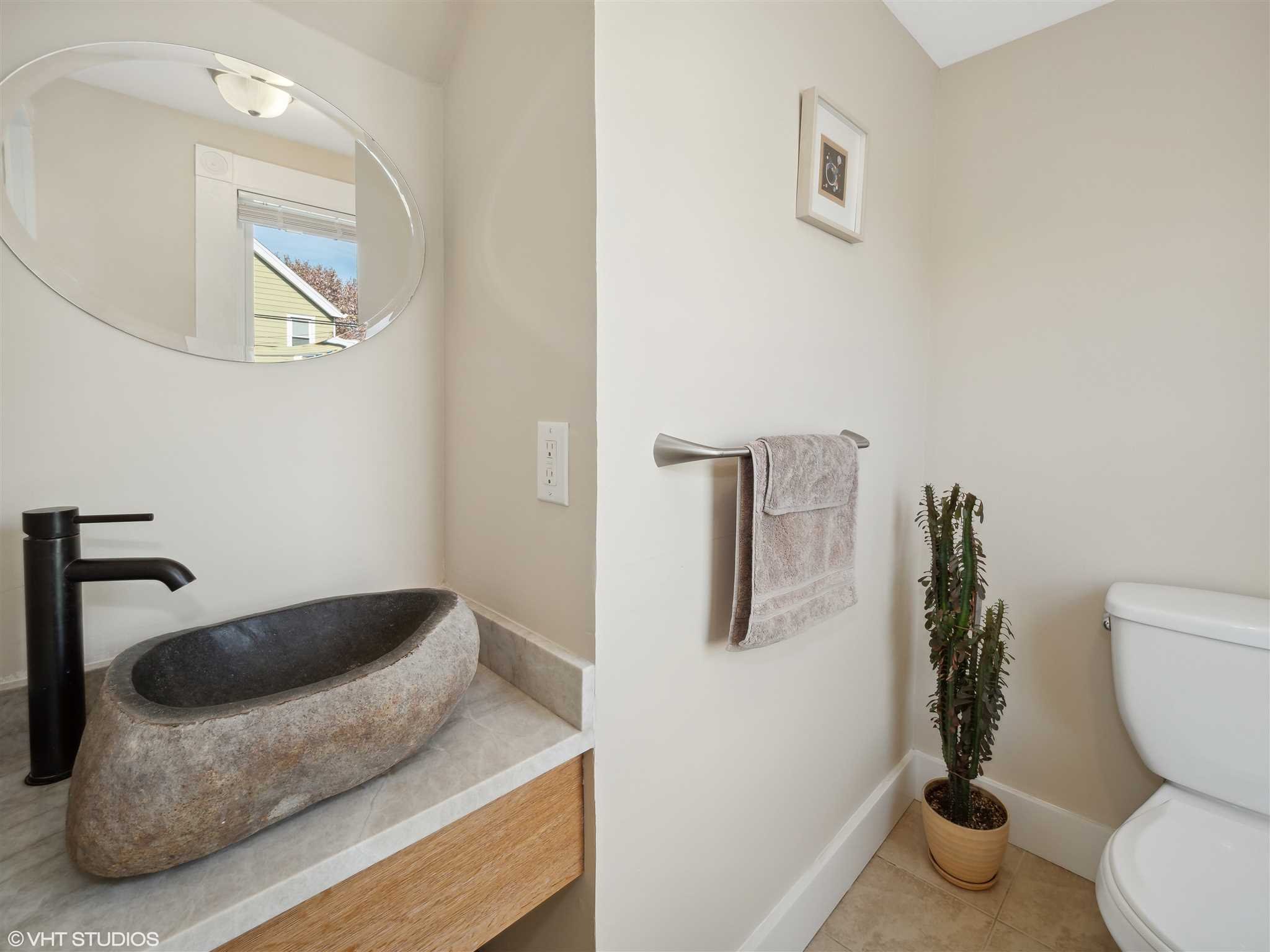 20 John Street Beacon, NY 12508 - Photo 22 of 36 a bathroom with a granite countertop toilet and a sink