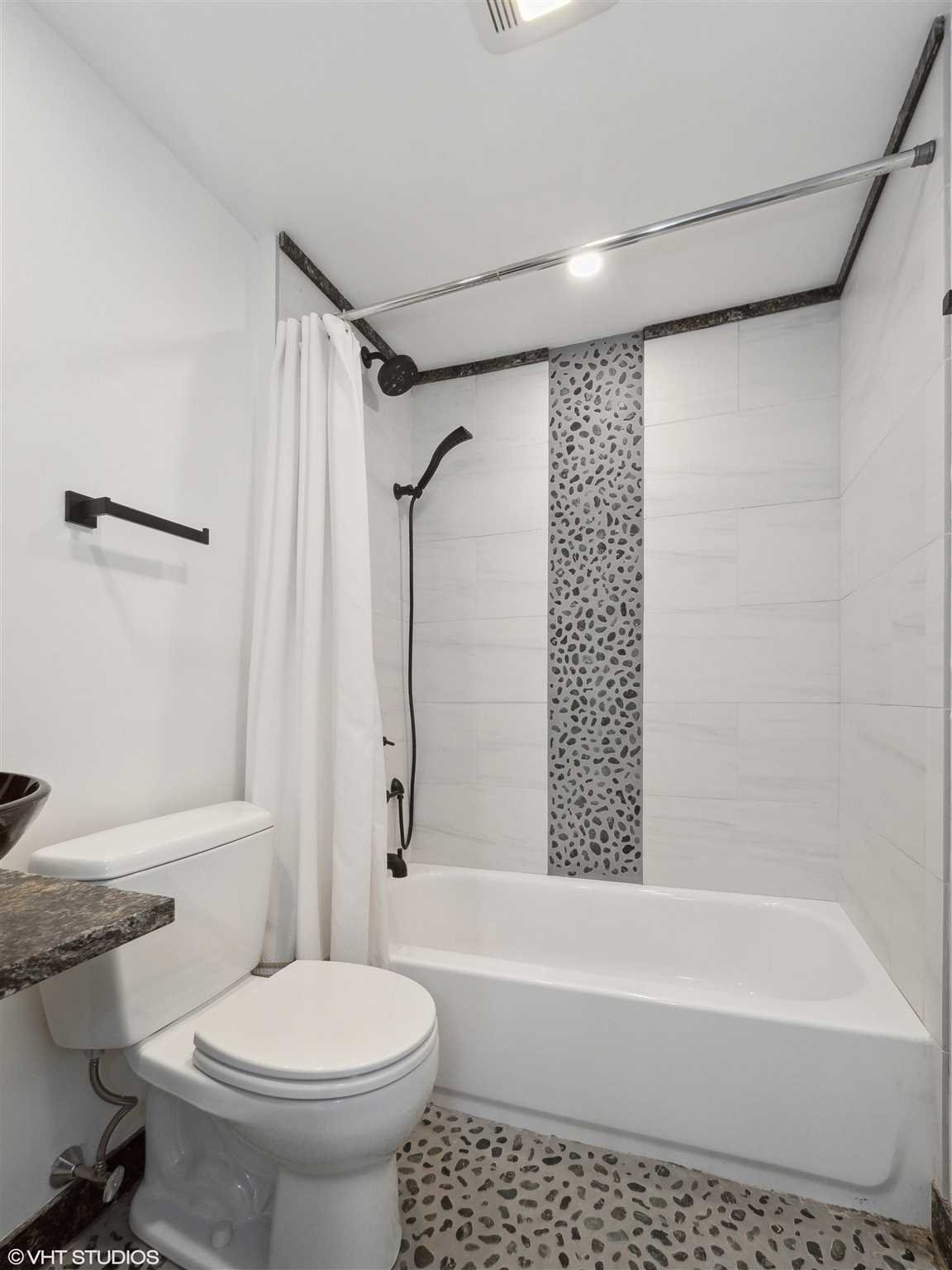 20 John Street Beacon, NY 12508 - Photo 25 of 36 a bathroom with a toilet and a bathtub