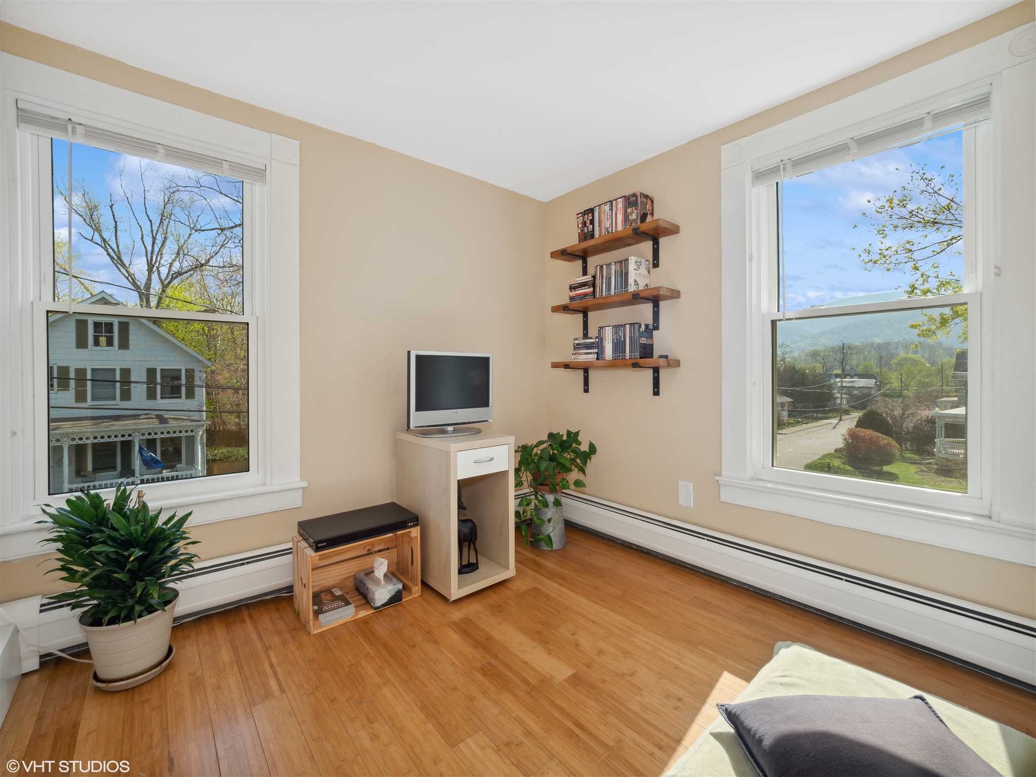 20 John Street Beacon, NY 12508 - Photo 27 of 36 a living room with furniture and a potted plant
