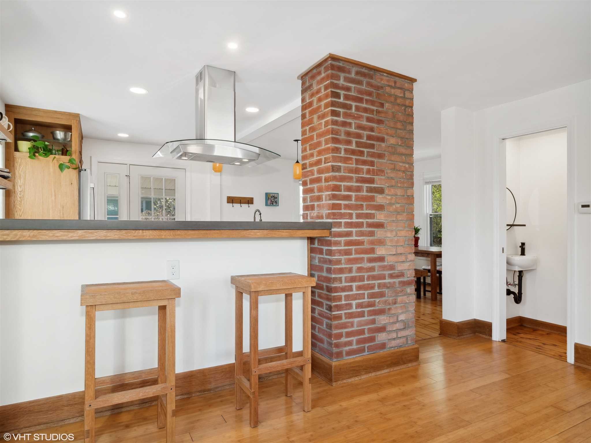 20 John Street Beacon, NY 12508 - Photo 10 of 36 a open kitchen with white cabinets and wooden floor