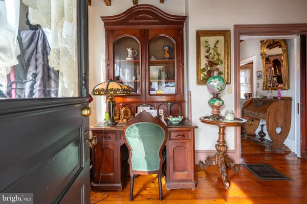 a kitchen with stainless steel appliances granite countertop a refrigerator a stove and a wooden floors
