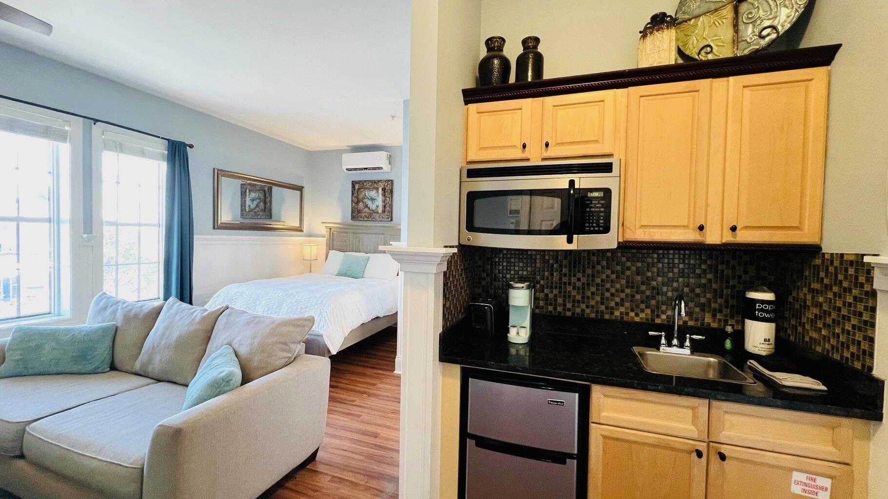 10343 East County Highway 30A, Unit B376 (BUILDING G) Inlet Beach, FL 32413 - Photo 6 of 20 a kitchen with stainless steel appliances granite countertop a stove a sink and a microwave