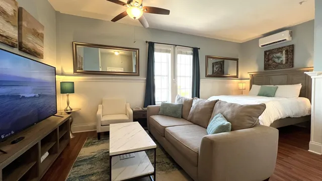 a living room with furniture and a flat screen tv