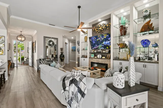 a view of a dining room with furniture wooden floor and chandelier