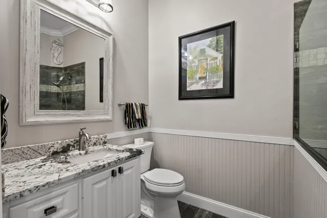 a view of a house with a backyard patio and swimming pool