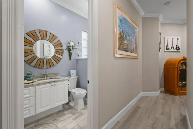 an aerial view of a house with outdoor space and lake view