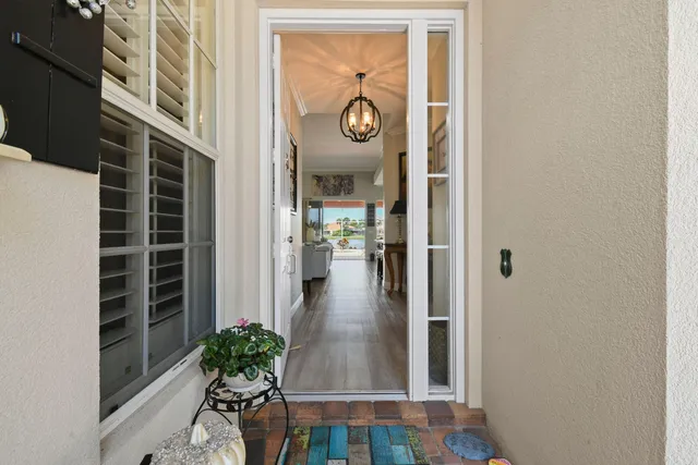 a living room with furniture a table and gym equipment
