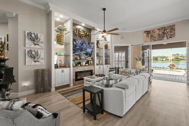 a kitchen with stainless steel appliances granite countertop white cabinets and a stove