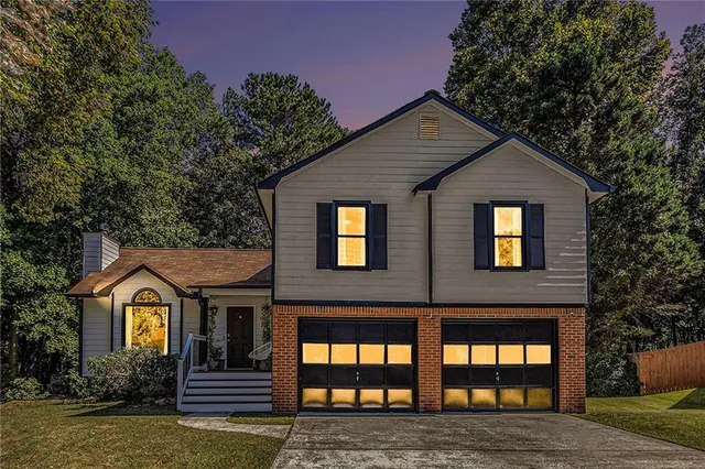 a front view of a house with garden
