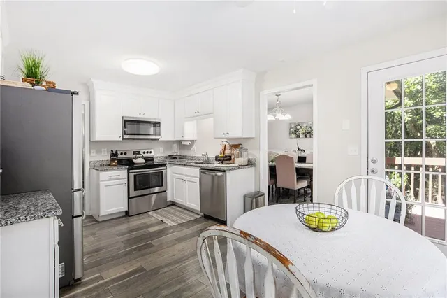 a kitchen with sink refrigerator and stove