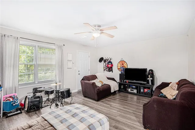 a bedroom with furniture and a window