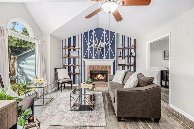 a living room with furniture and a fireplace