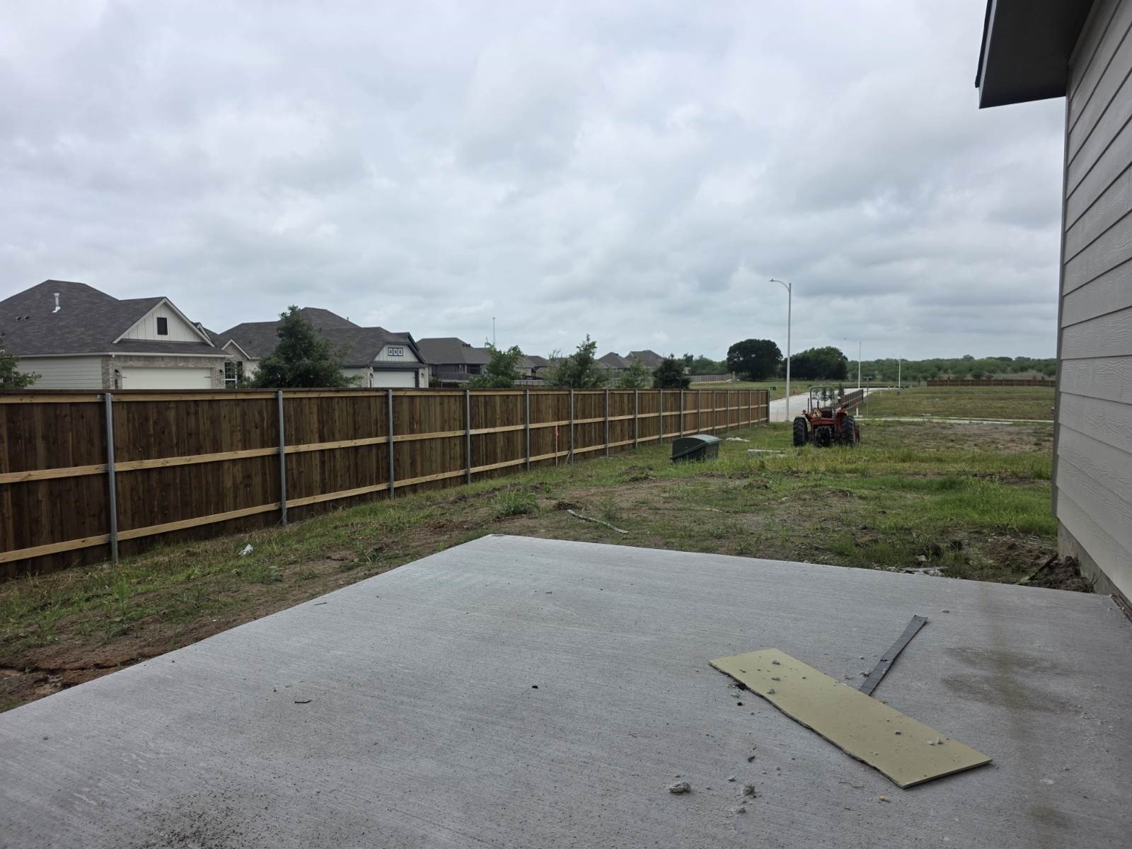 1500 Lk Rdg Drive Brenham, TX 77833 - Photo 7 of 13 a view of a garden with a wooden fence