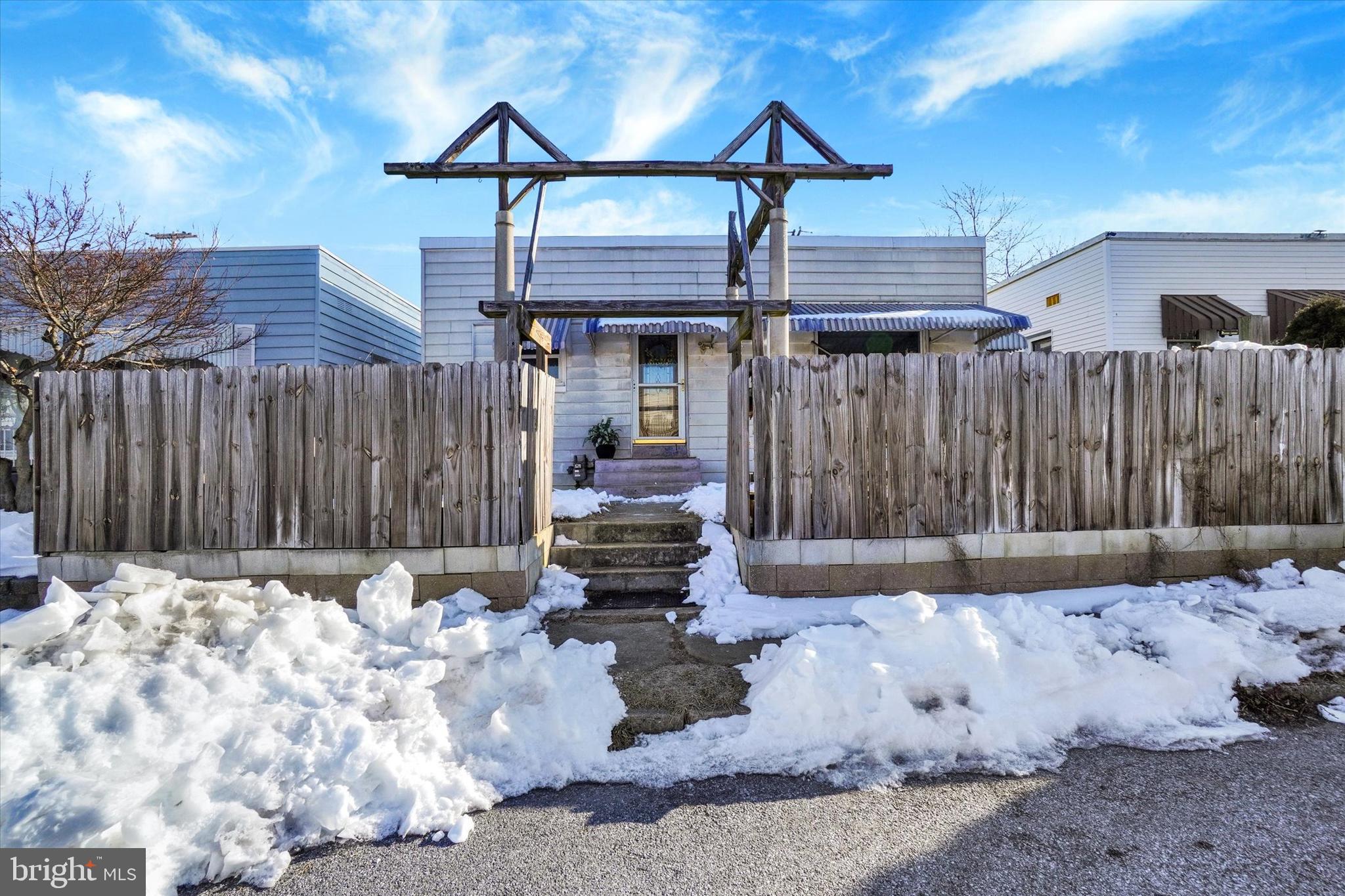 321 Frederick Court York, PA 17403 - Photo 19 of 24 a wooden bench sitting in front of a house