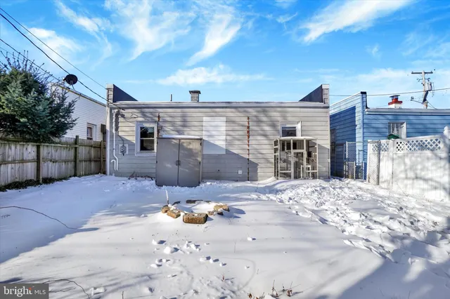 a view of a yard with a snow on the road