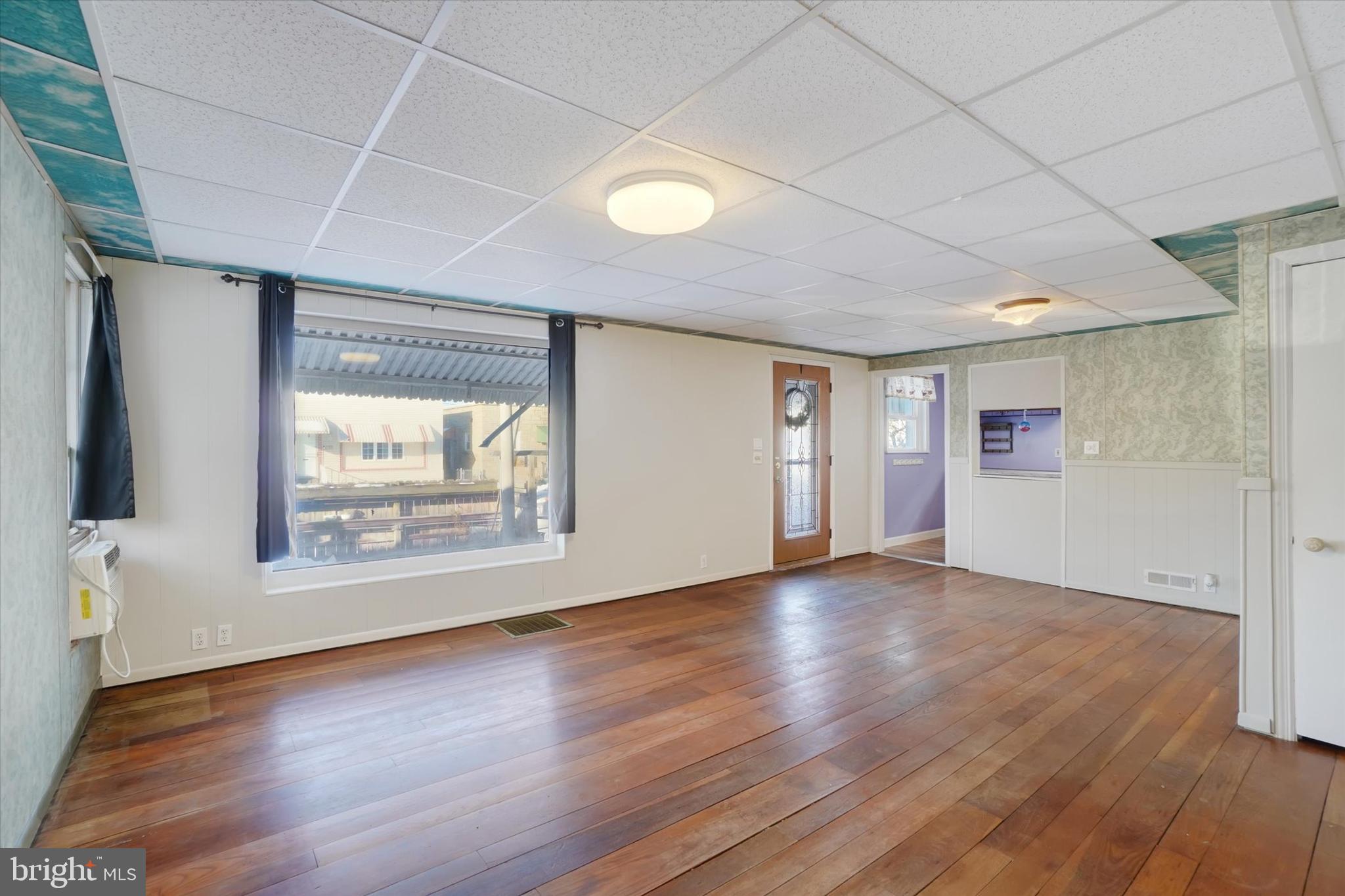 321 Frederick Court York, PA 17403 - Photo 3 of 24 a view of an empty room with wooden floor and a window