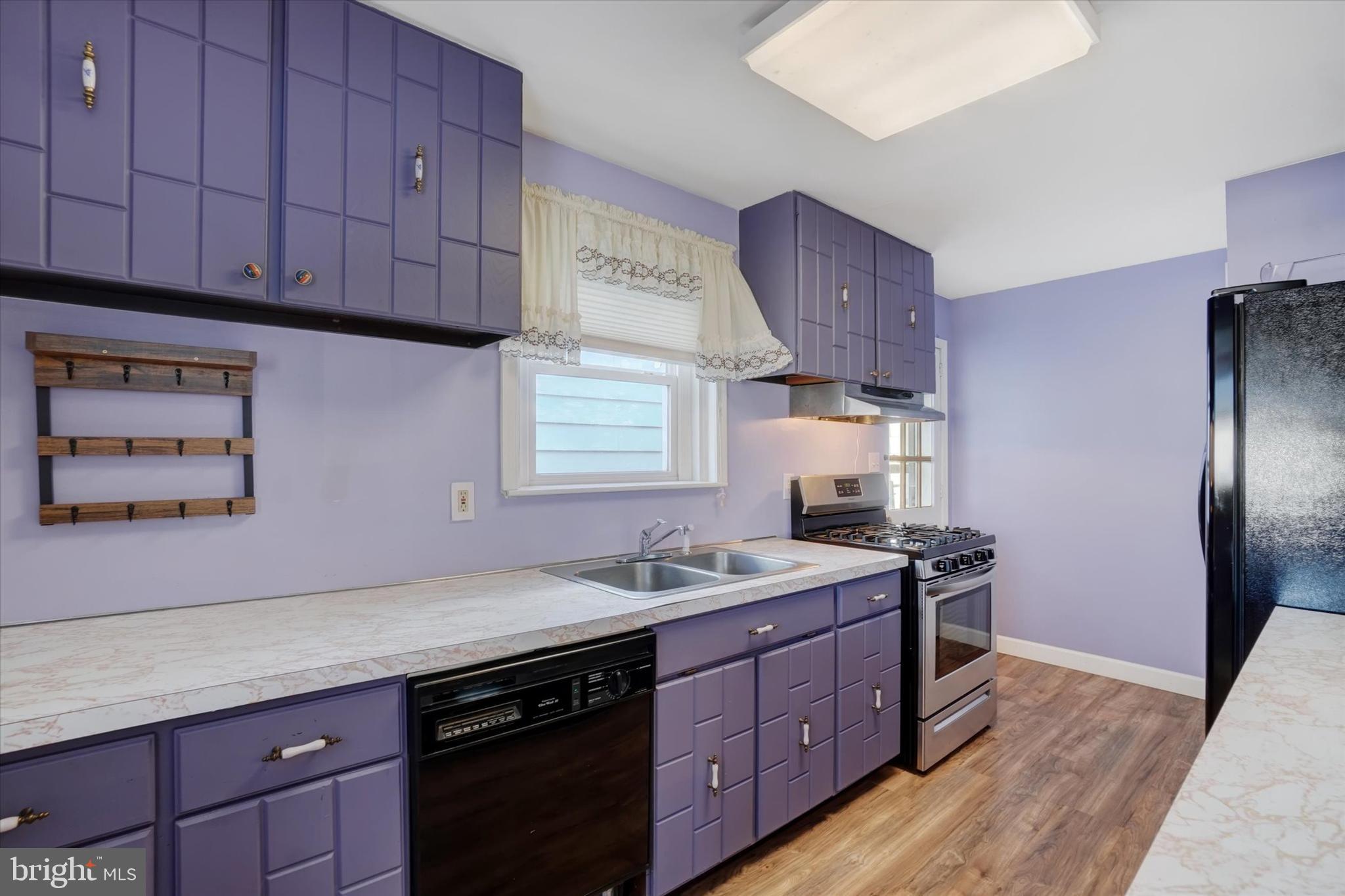 321 Frederick Court York, PA 17403 - Photo 6 of 24 a kitchen with stainless steel appliances granite countertop a sink stove and refrigerator
