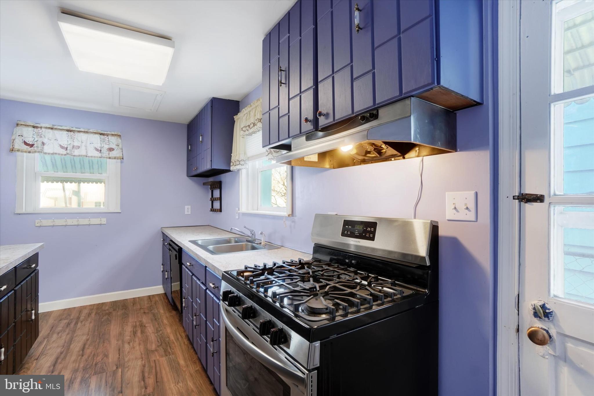321 Frederick Court York, PA 17403 - Photo 8 of 24 a kitchen with stainless steel appliances granite countertop a stove and a wooden cabinets