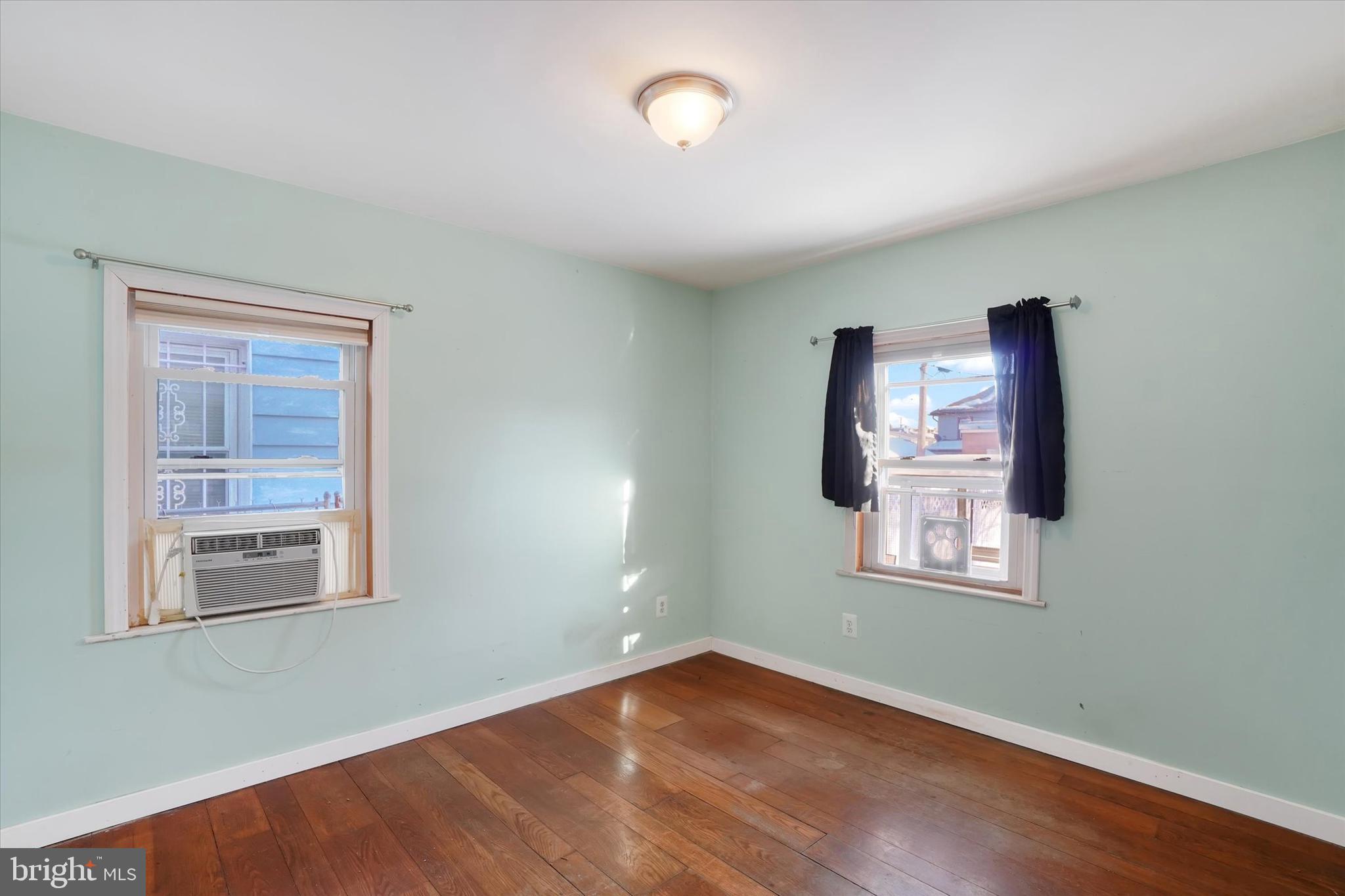 321 Frederick Court York, PA 17403 - Photo 10 of 24 an empty room with wooden floor and windows