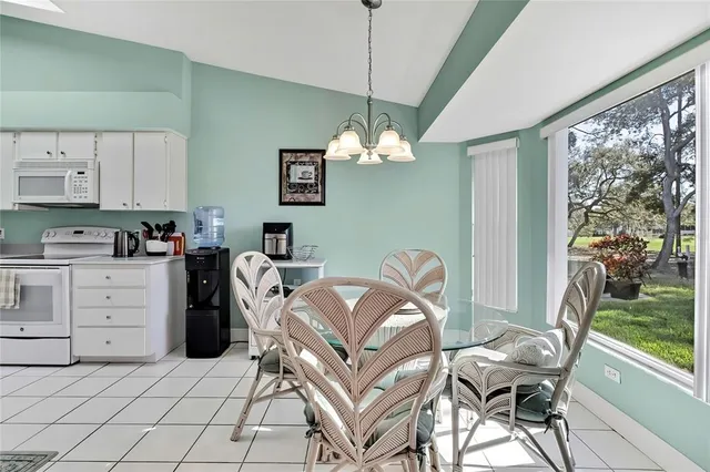 a living room with furniture a window and a flat screen tv