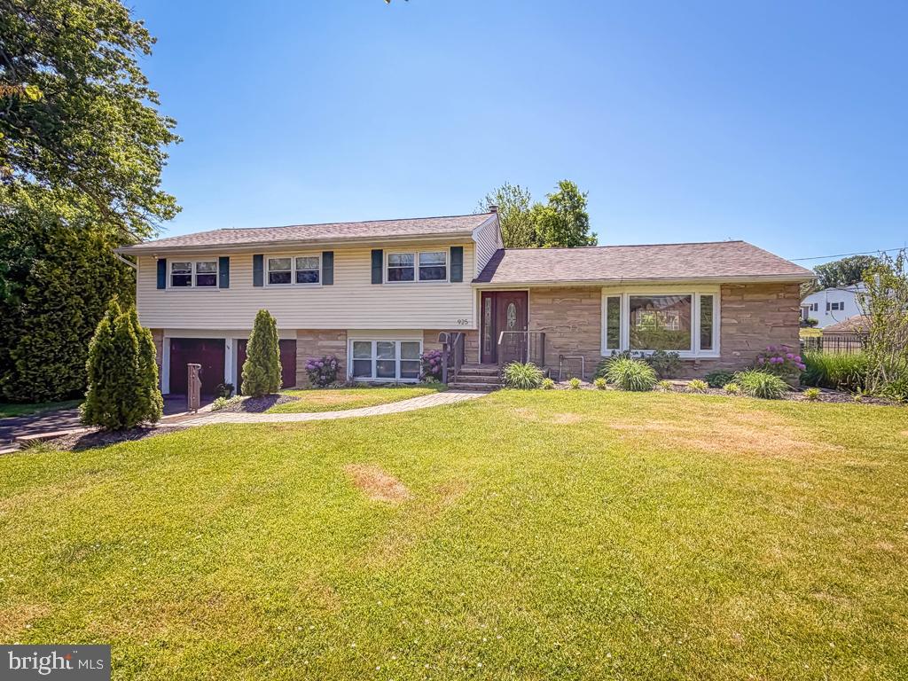 925 Big Oak Road Yardley, PA 19067 - Photo 2 of 51 a front view of a house with swimming pool having outdoor seating