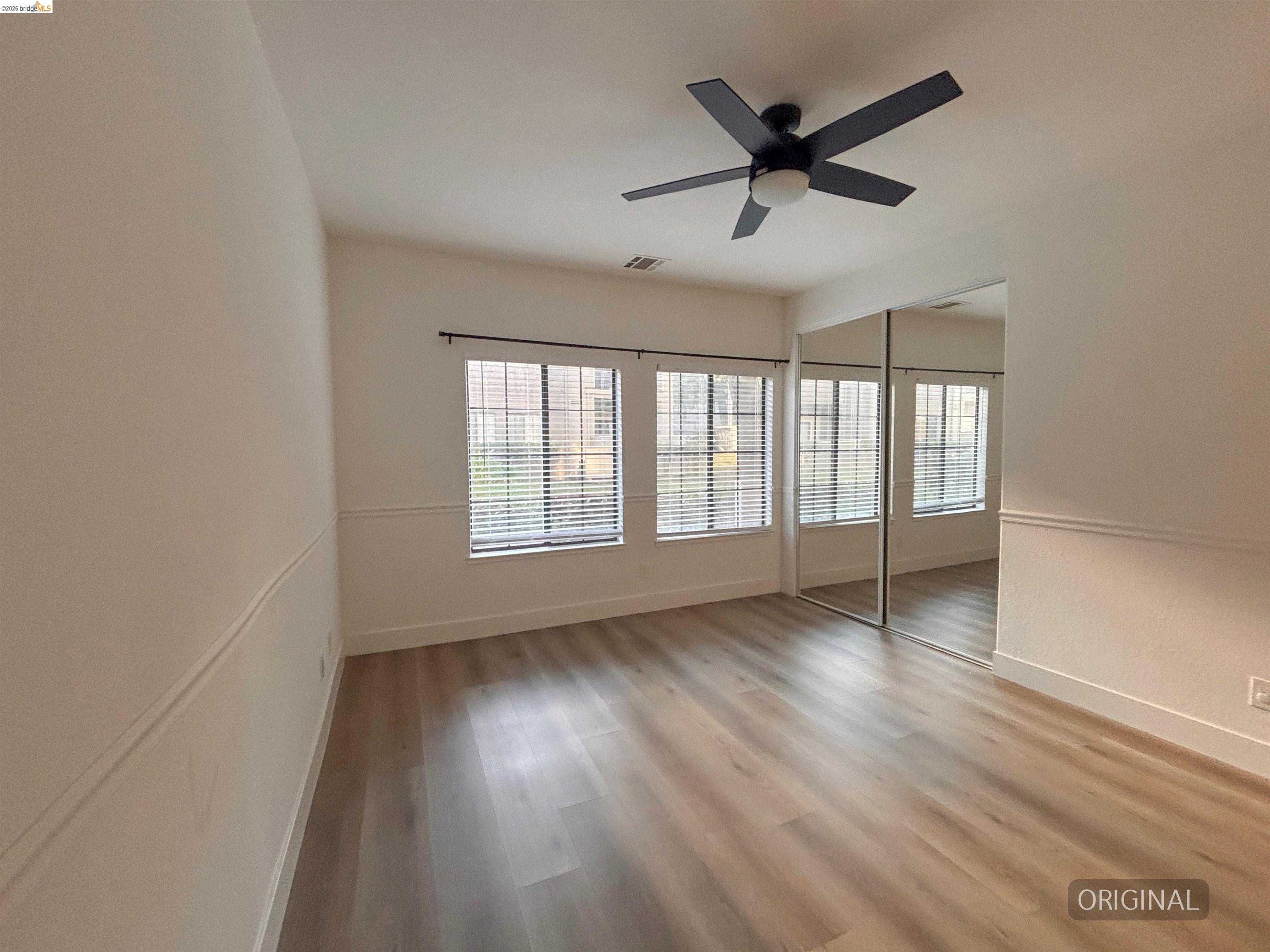 450 Pine Ridge Drive San Ramon, CA 94582 - Photo 10 of 18 wooden floor in an empty room with a window