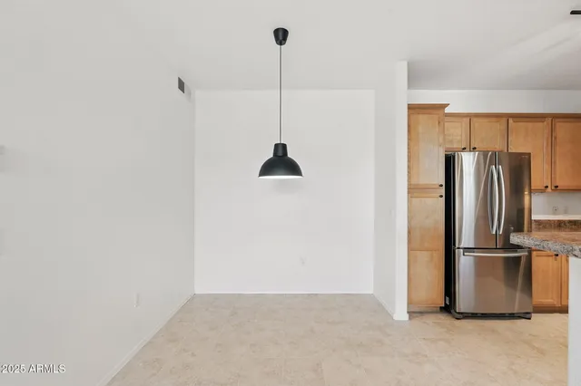 a view of a kitchen with a refrigerator