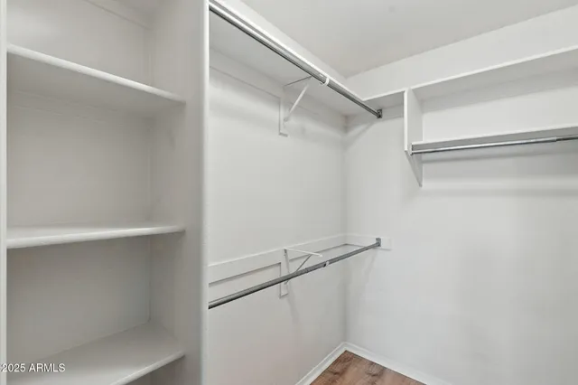 a view of an empty walk in closet