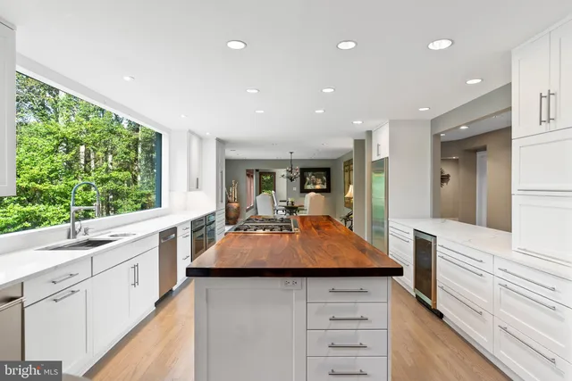 a vase of white flowers sitting on a table