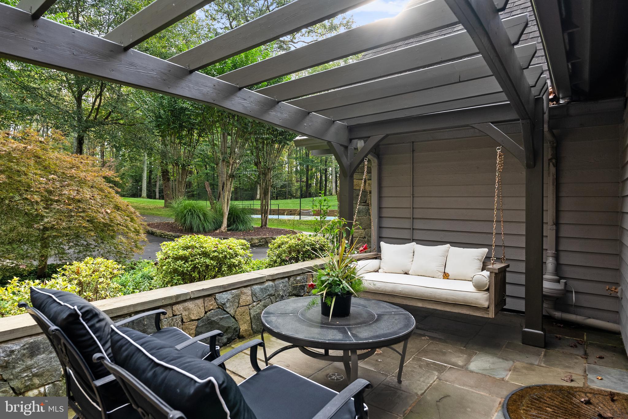 536 Springvale Road Great Falls, VA 22066 - Photo 62 of 139 a outdoor living space with furniture and a garden