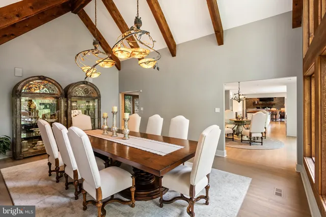 a living room with furniture a large window and a fireplace