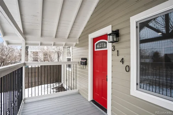 a view of a porch with wooden floor