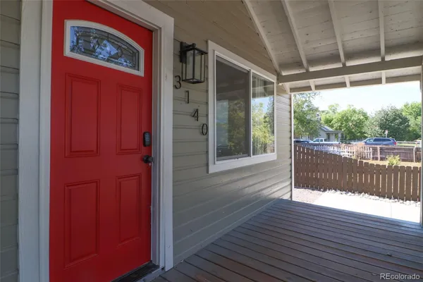 a view of a porch with wooden floor and outdoor space