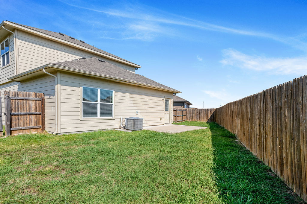 12105 Greywacke Drive Manor, TX 78653 - Photo 17 of 18 a house view with a backyard space