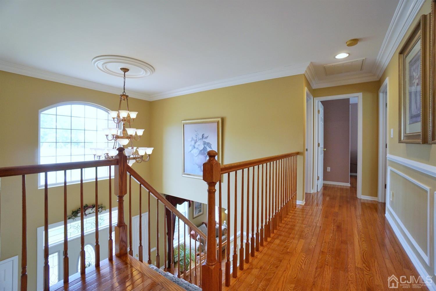 54 Stratton Road Old Bridge, NJ 07747 - Photo 14 of 23 a view of a hallway with wooden floor and windows