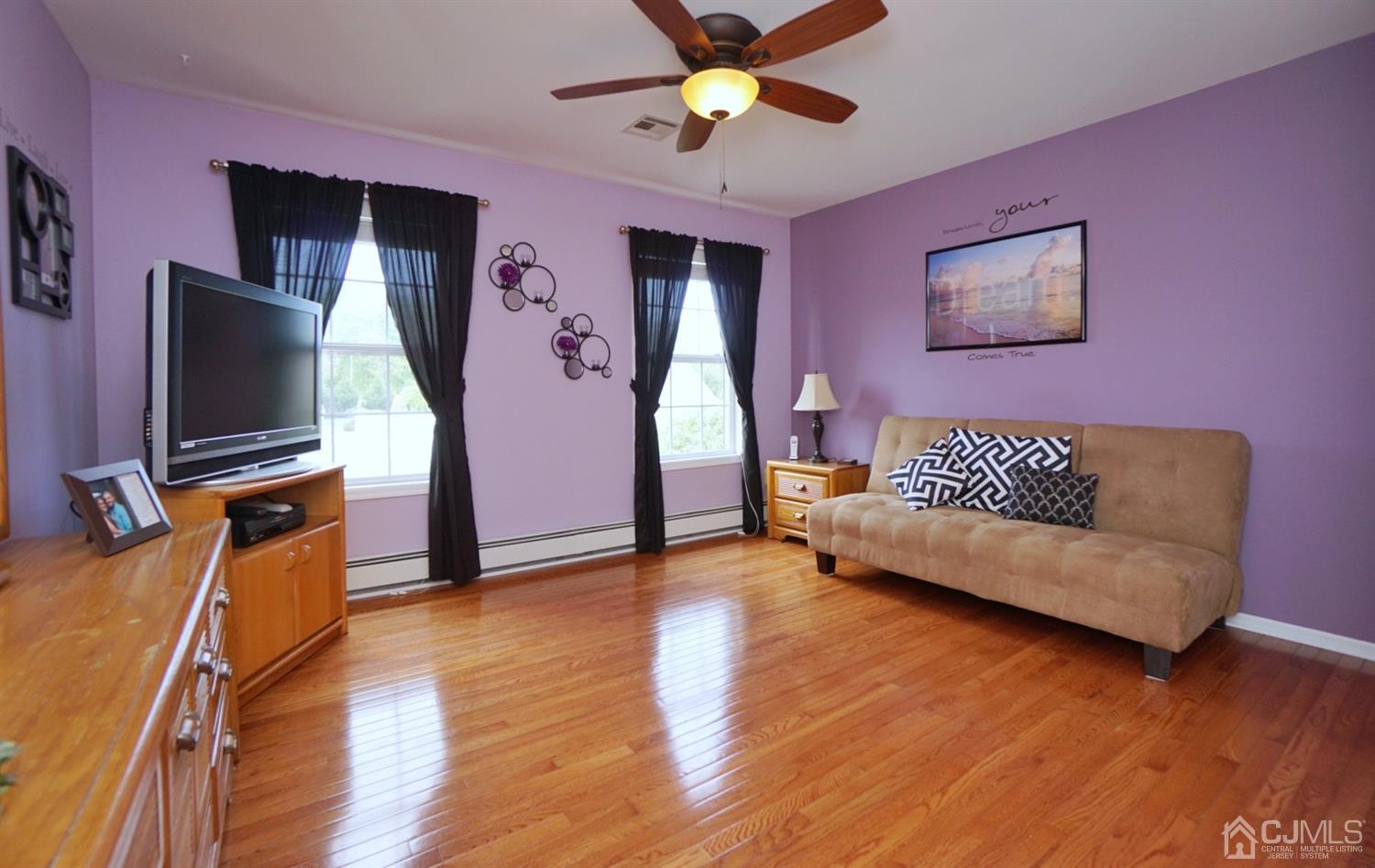 54 Stratton Road Old Bridge, NJ 07747 - Photo 15 of 23 a living room with furniture and a flat screen tv