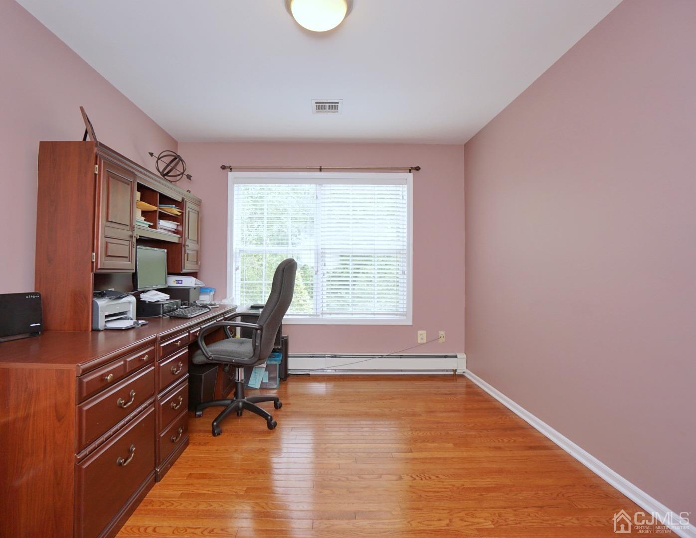 54 Stratton Road Old Bridge, NJ 07747 - Photo 17 of 23 a view of a workspace with furniture and a window