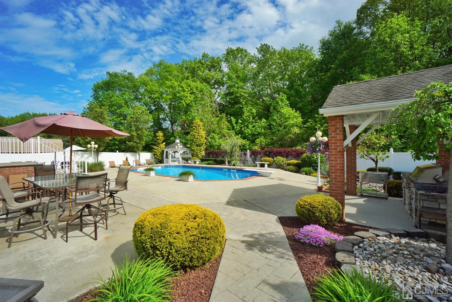 54 Stratton Road Old Bridge, NJ 07747 - Photo 18 of 23 a view of a swimming pool with a patio
