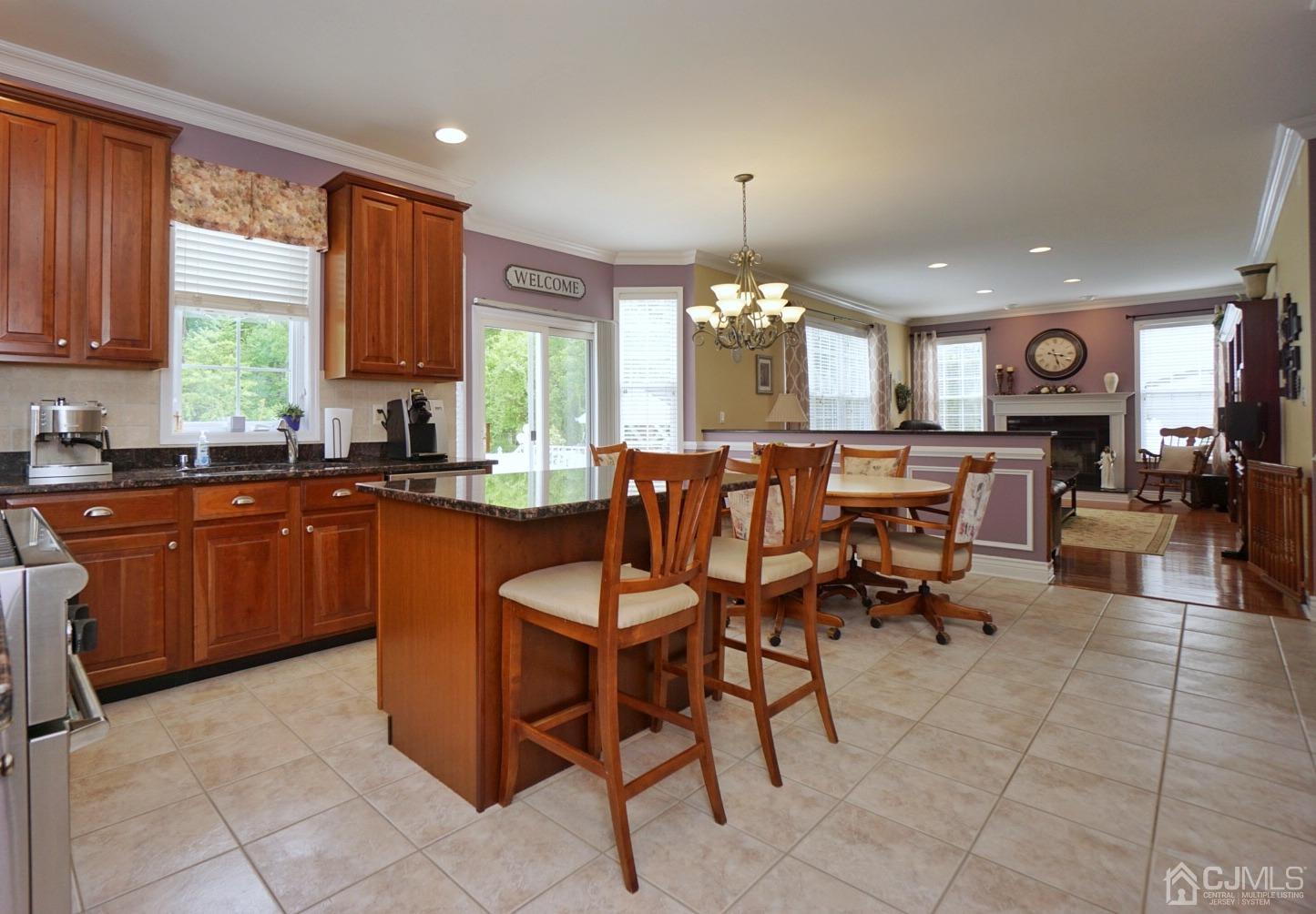 54 Stratton Road Old Bridge, NJ 07747 - Photo 7 of 23 a large kitchen with a table and chairs