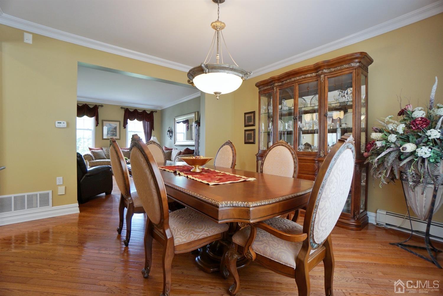 54 Stratton Road Old Bridge, NJ 07747 - Photo 9 of 23 a view of a dining room with furniture window and wooden floor