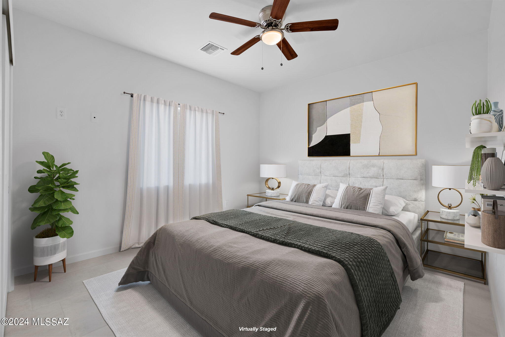 1835 America Court Rio Rico, AZ 85648 - Photo 16 of 35 a bedroom with a bed and a potted plant
