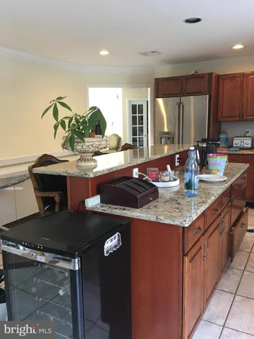 a kitchen with granite countertop a sink and cabinets