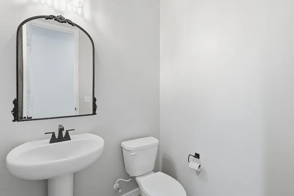 a kitchen with a sink a counter space appliances and a window