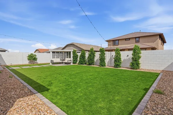 a kitchen with kitchen island a sink a center island and stainless steel appliances